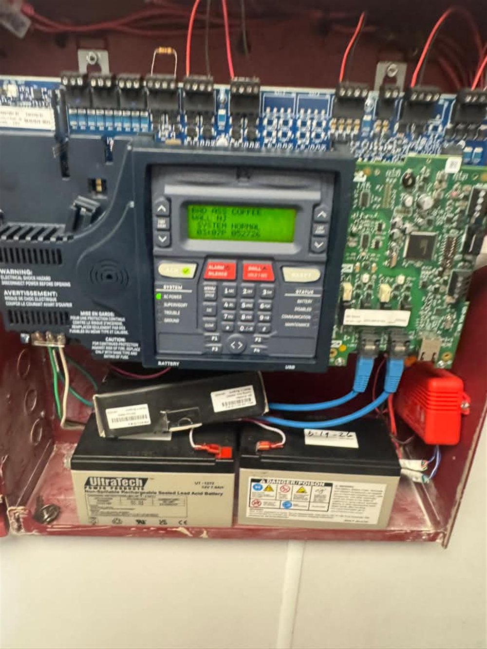 Programmed fire alarm control panel with battery backup, installed and monitored by Nextgen Electric at a commercial facility in New Jersey